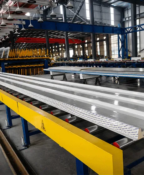 Insulated metal panels moving through production equipment