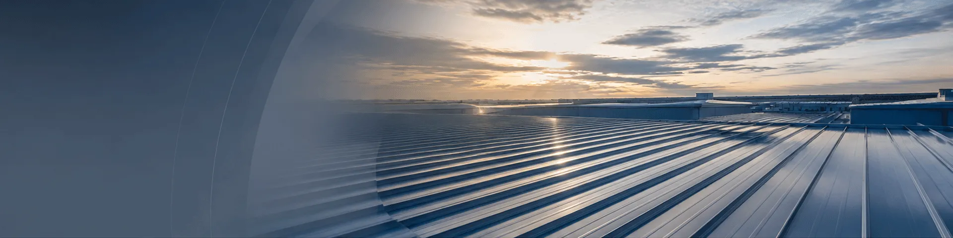 Insulated metal roofing system at sunset